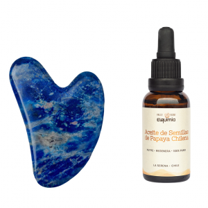 roca azul en forma de corazón de lapislázuli con botellla ambar de 30 ml de aceite de papaya marca elquimia
